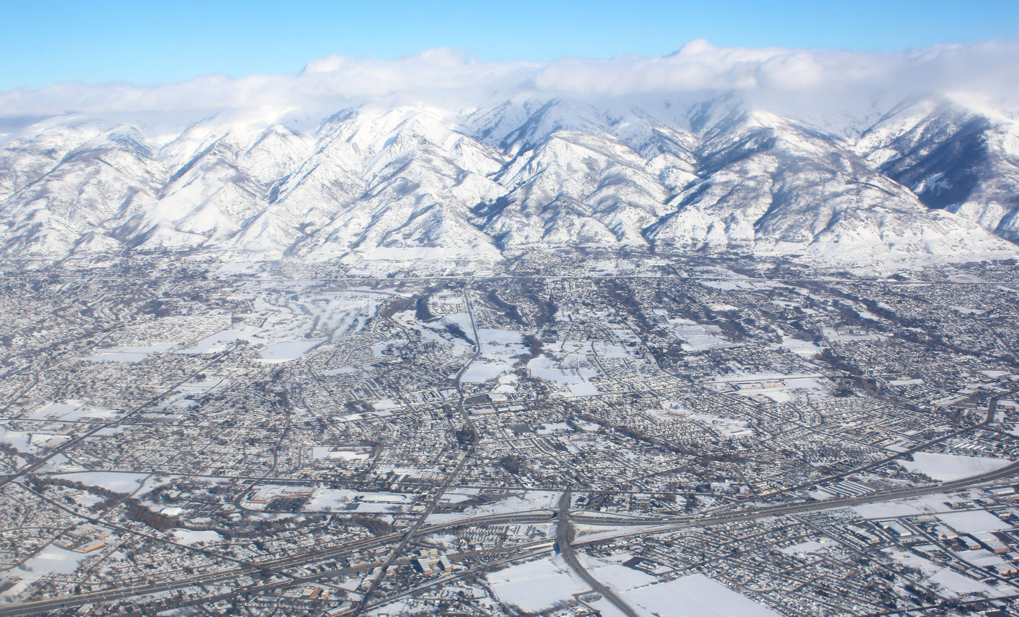 The Wasatch from the air in winter — the range Park City sits against.